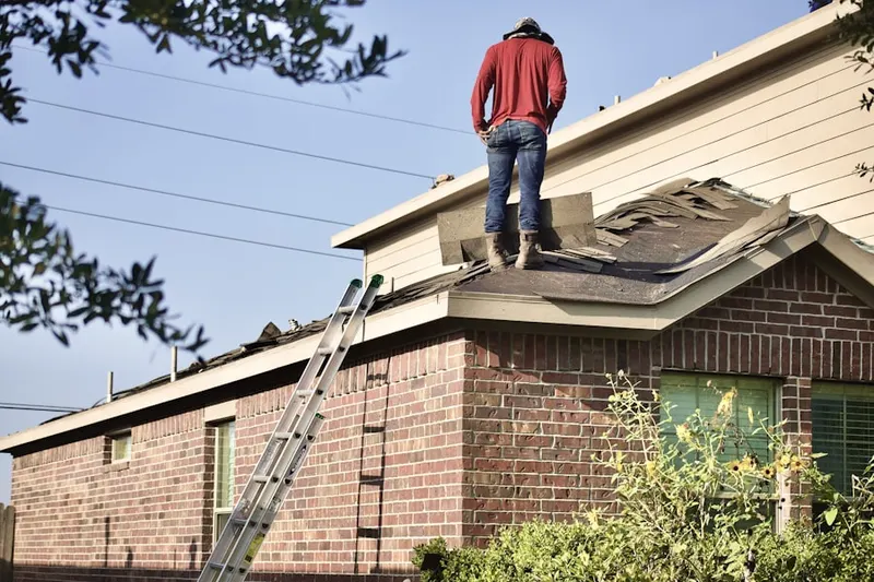 Professional roofer working on a residential roof in Evanston